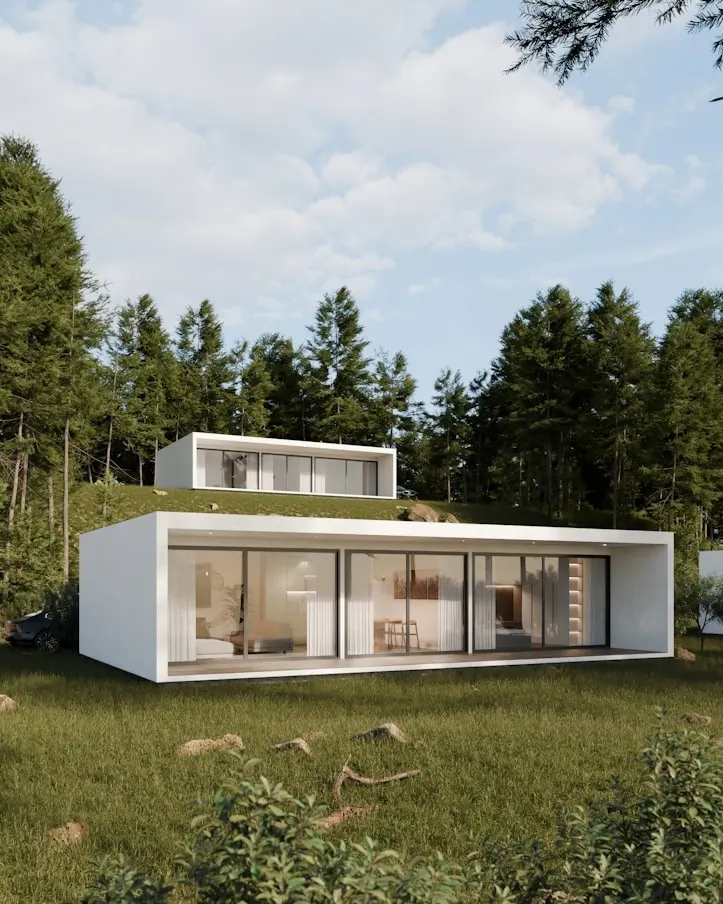 Long white villa with full-height glazing set into a forest clearing